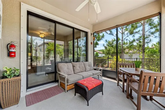 an aerial view of a house with a yard and a black car parked