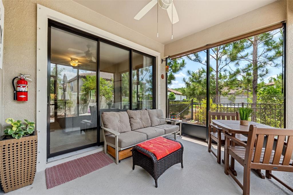 3877 Burdick Loop Odessa, FL 33556 - Photo 36 of 64 a living room with furniture and a large window