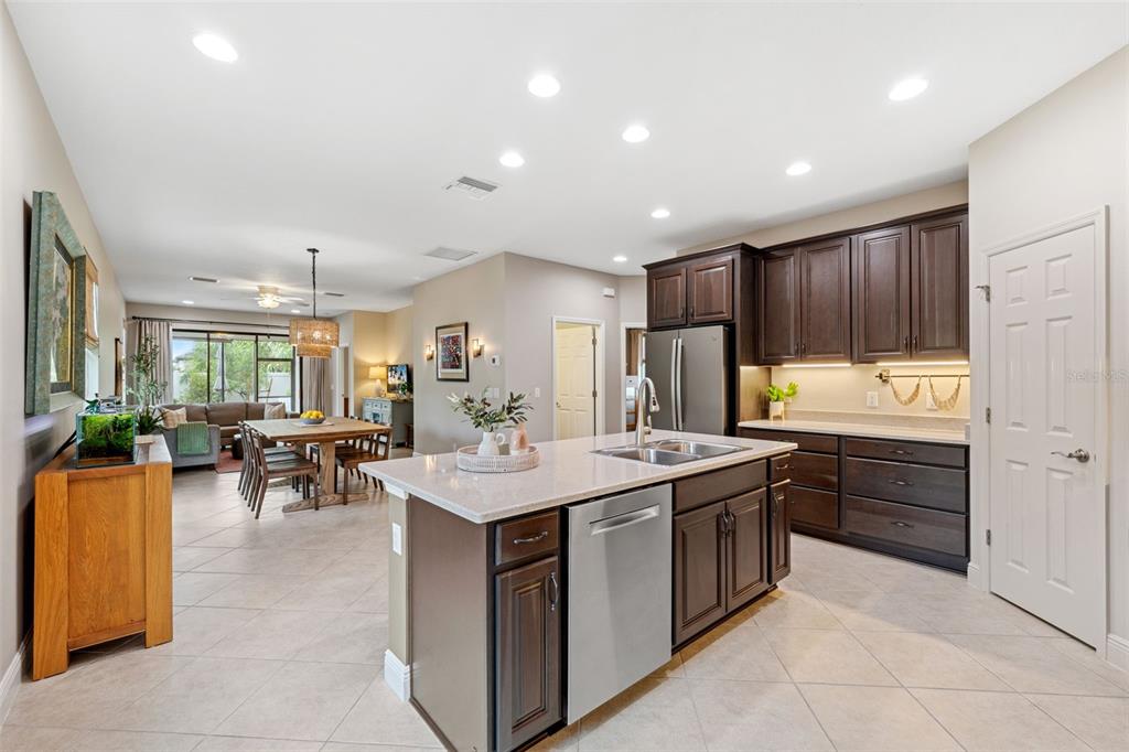 3877 Burdick Loop Odessa, FL 33556 - Photo 6 of 64 a kitchen with sink cabinets and stove