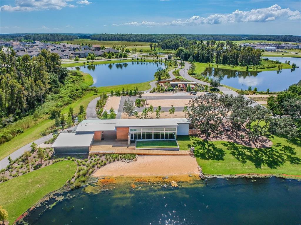 3877 Burdick Loop Odessa, FL 33556 - Photo 63 of 64 an aerial view of a house with a garden and lake view