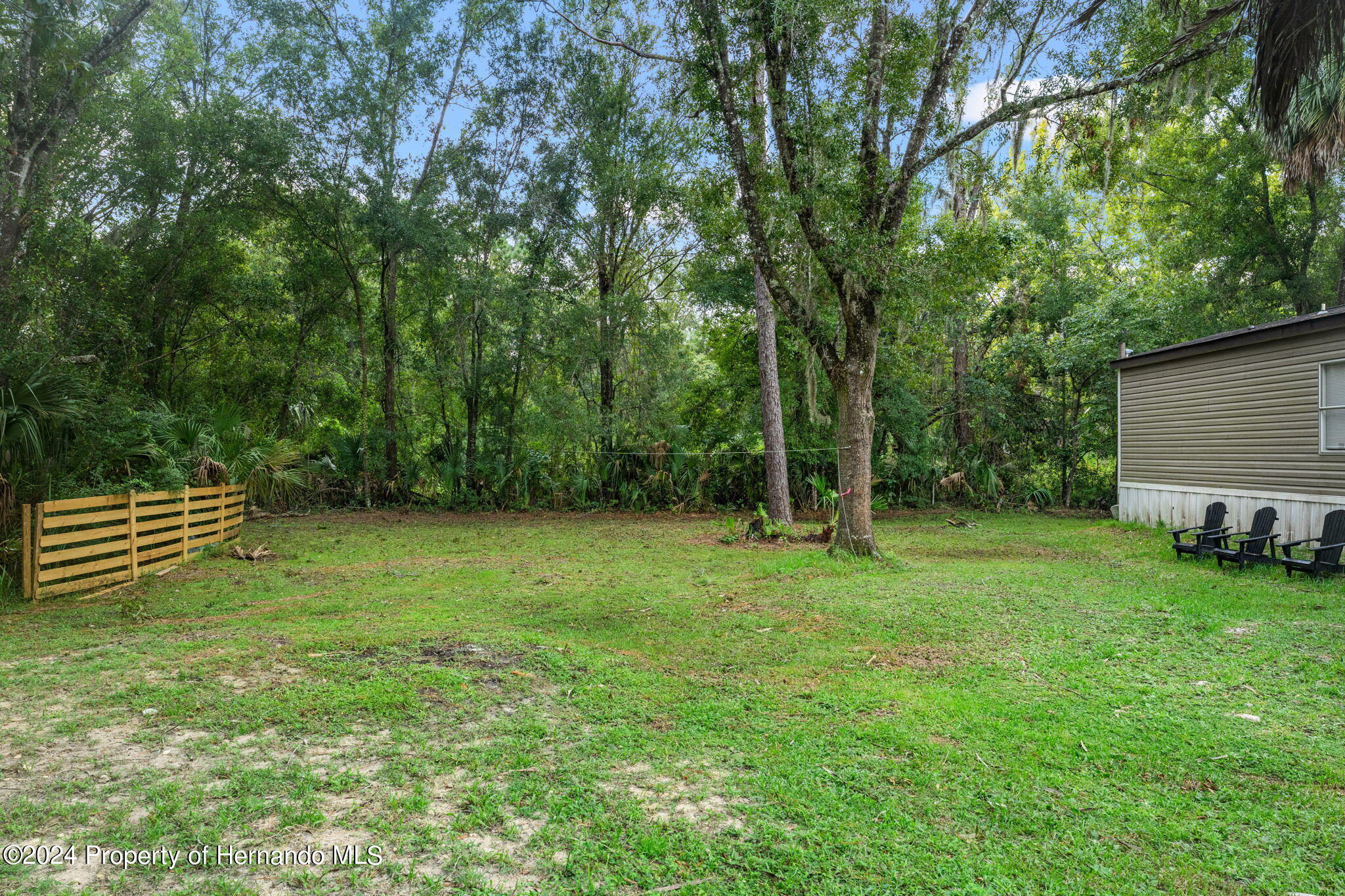 935 South Crystal Grove Point Homosassa, FL 34448 - Photo 18 of 23 a view of a backyard with a garden