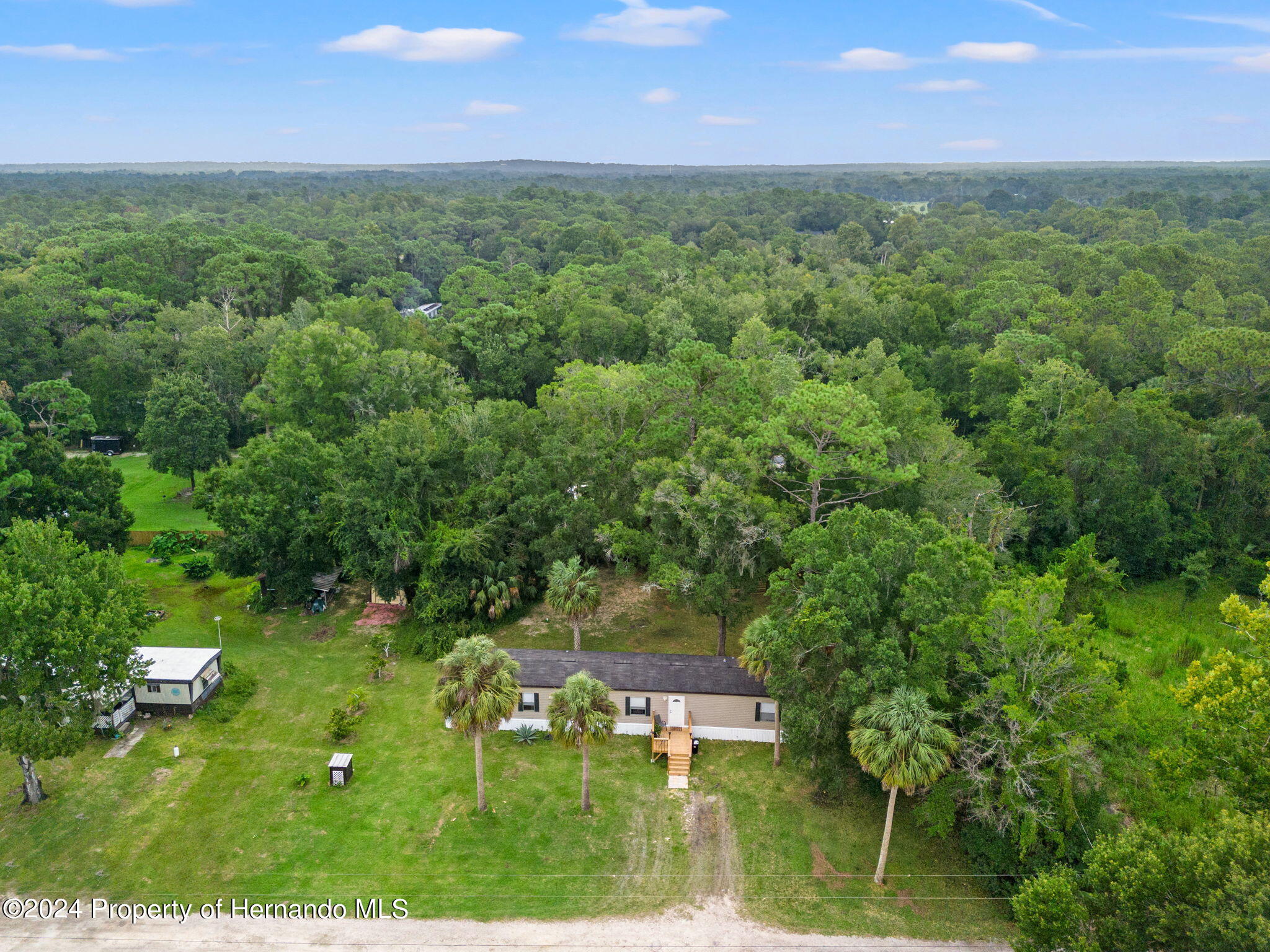 935 South Crystal Grove Point Homosassa, FL 34448 - Photo 22 of 23 an aerial view of a house with a yard