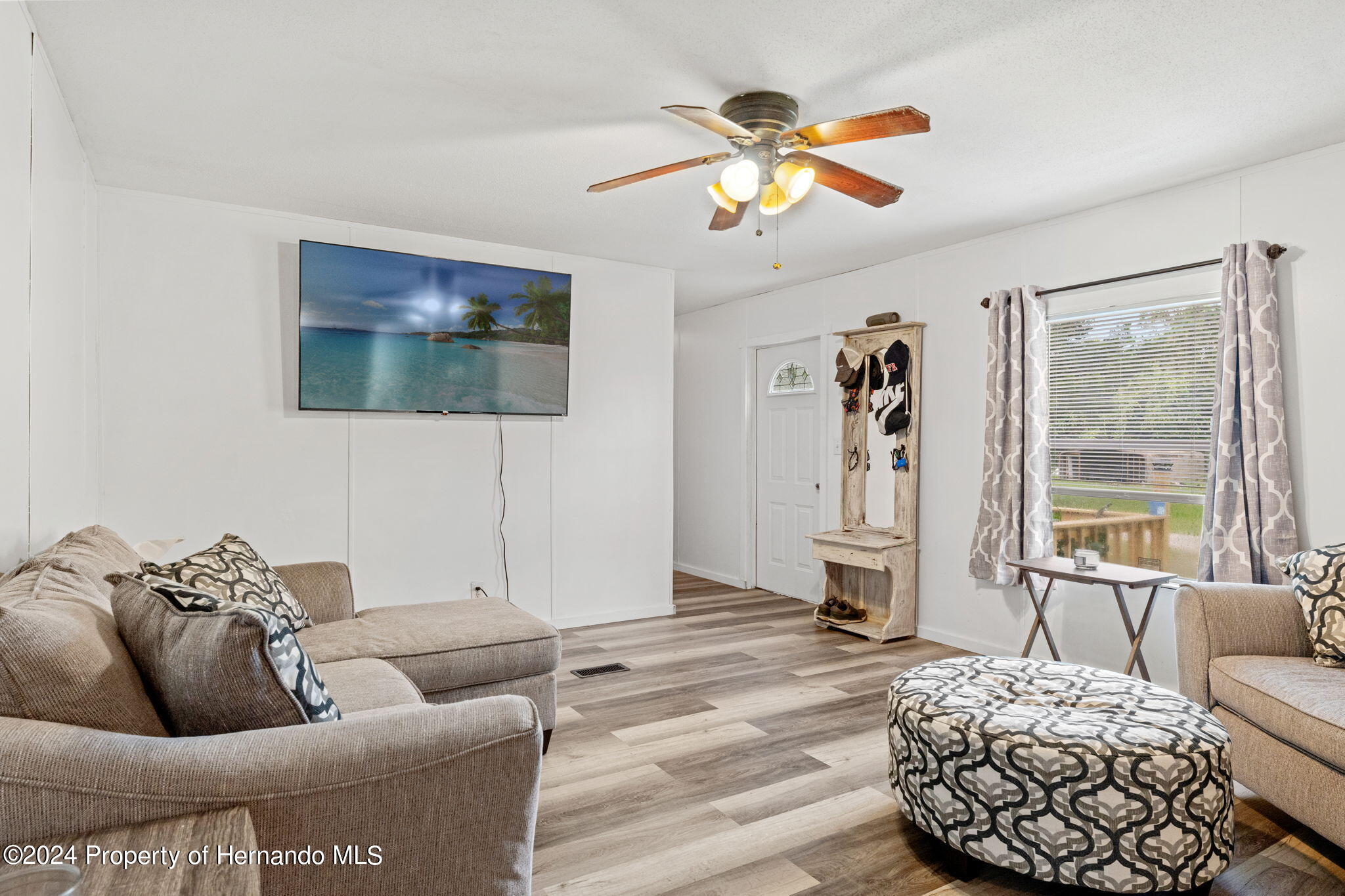 935 South Crystal Grove Point Homosassa, FL 34448 - Photo 3 of 23 a living room with furniture and a flat screen tv
