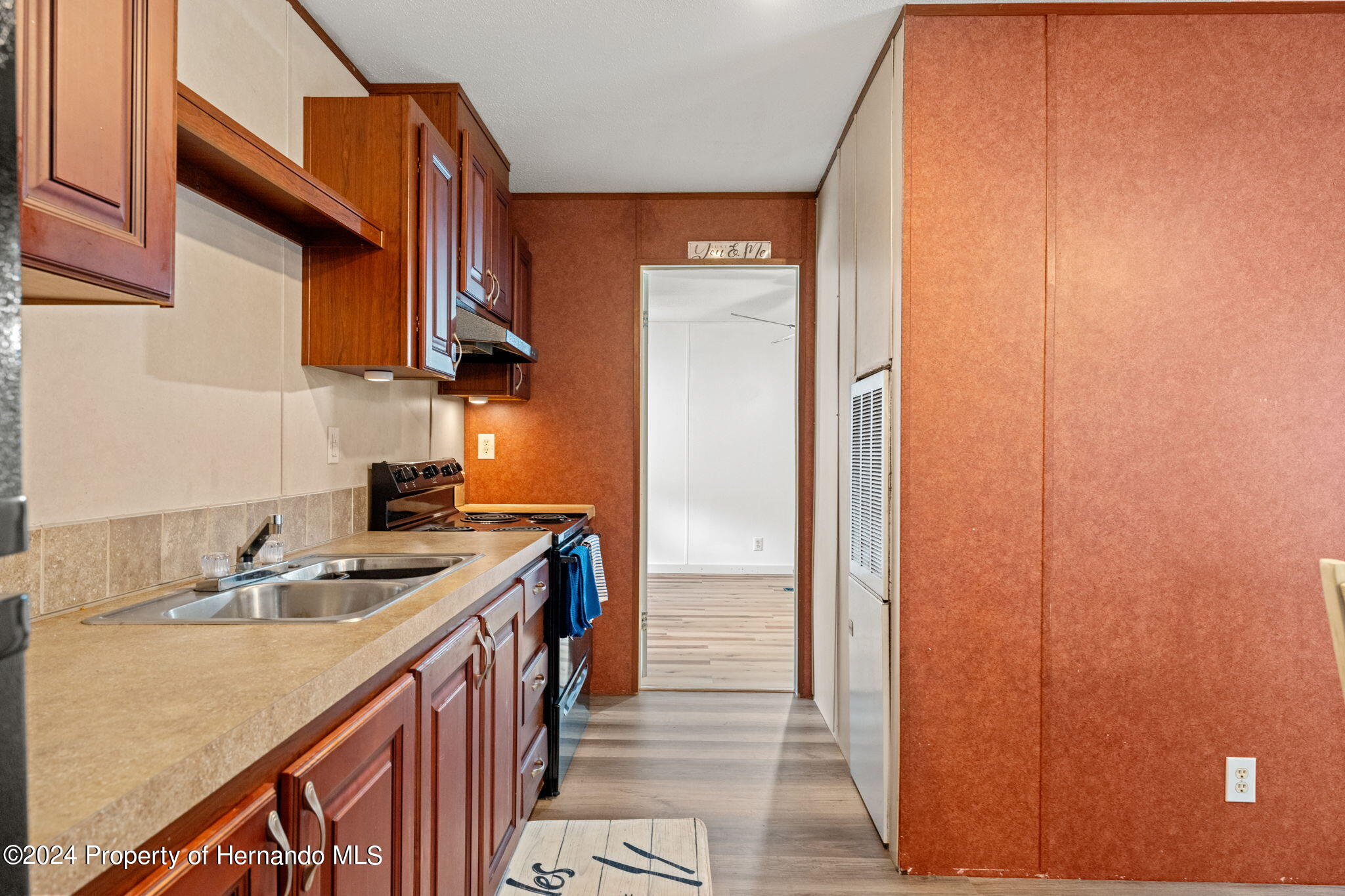 935 South Crystal Grove Point Homosassa, FL 34448 - Photo 6 of 23 a kitchen with a sink and a refrigerator