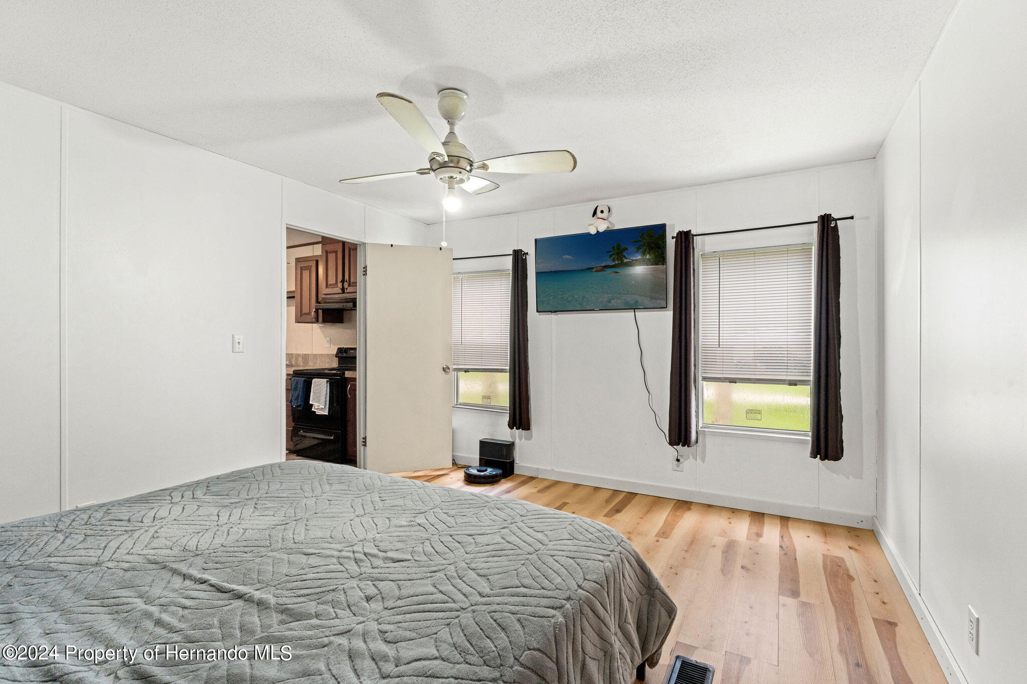 935 South Crystal Grove Point Homosassa, FL 34448 - Photo 8 of 23 a bedroom with a bed and a chandelier