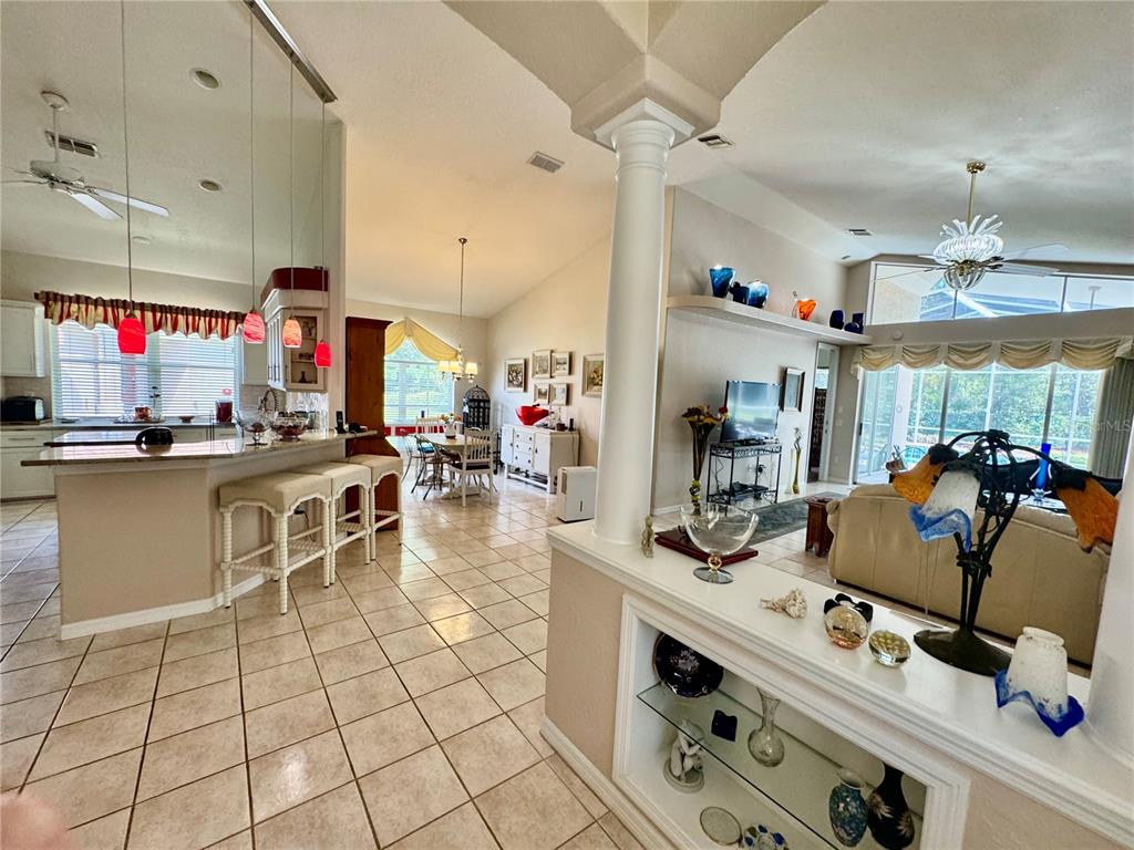 5688 Legend Hills Lane Spring Hill, FL 34609 - Photo 21 of 74 a kitchen with stainless steel appliances kitchen island granite countertop a sink and cabinets
