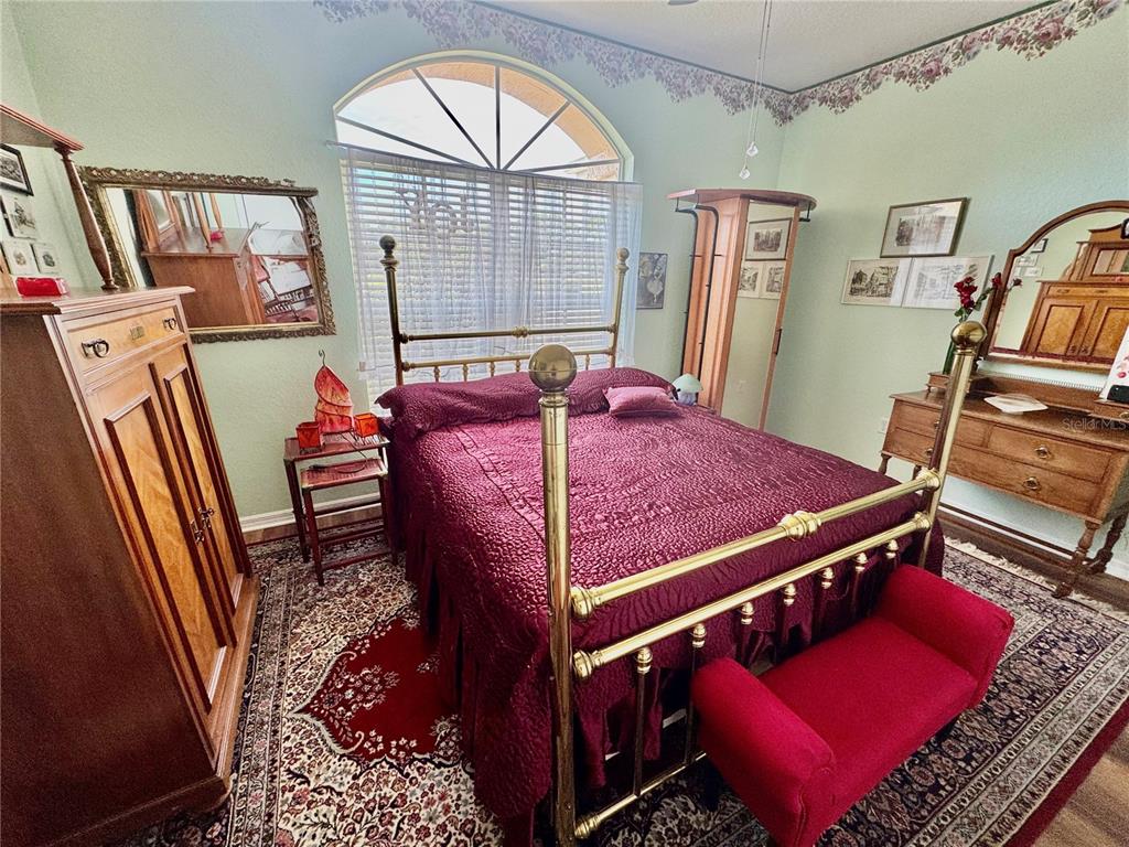 5688 Legend Hills Lane Spring Hill, FL 34609 - Photo 35 of 74 a bed room with a bed next to a window