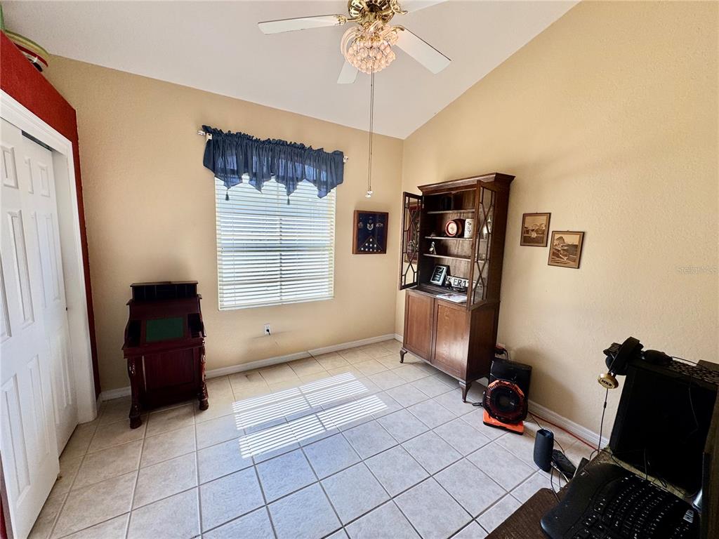 5688 Legend Hills Lane Spring Hill, FL 34609 - Photo 36 of 74 a room with furniture and a window