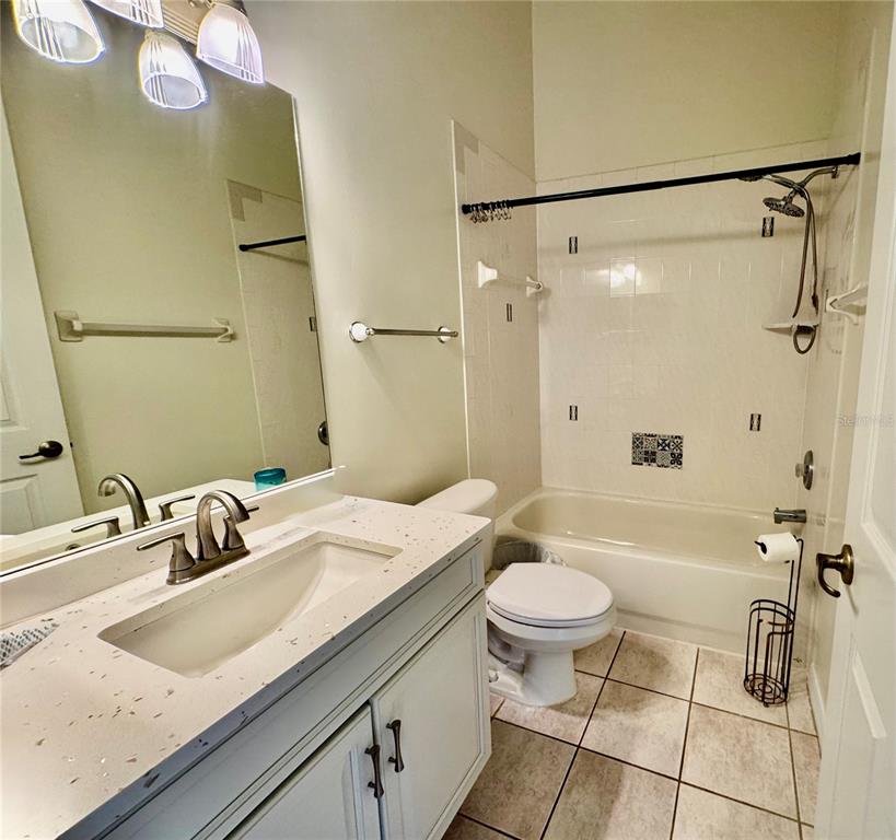 5688 Legend Hills Lane Spring Hill, FL 34609 - Photo 37 of 74 a bathroom with a sink a toilet and a mirror