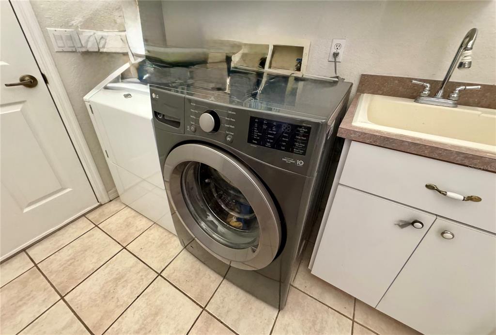 5688 Legend Hills Lane Spring Hill, FL 34609 - Photo 54 of 74 a utility room with dryer and washer
