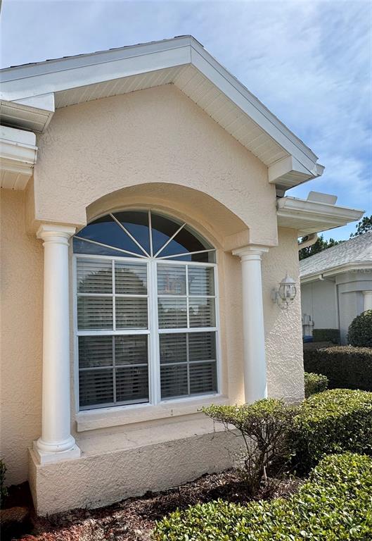 5688 Legend Hills Lane Spring Hill, FL 34609 - Photo 72 of 74 a front view of a house with a yard