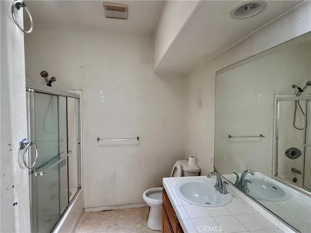 a bathroom with a sink and toilet