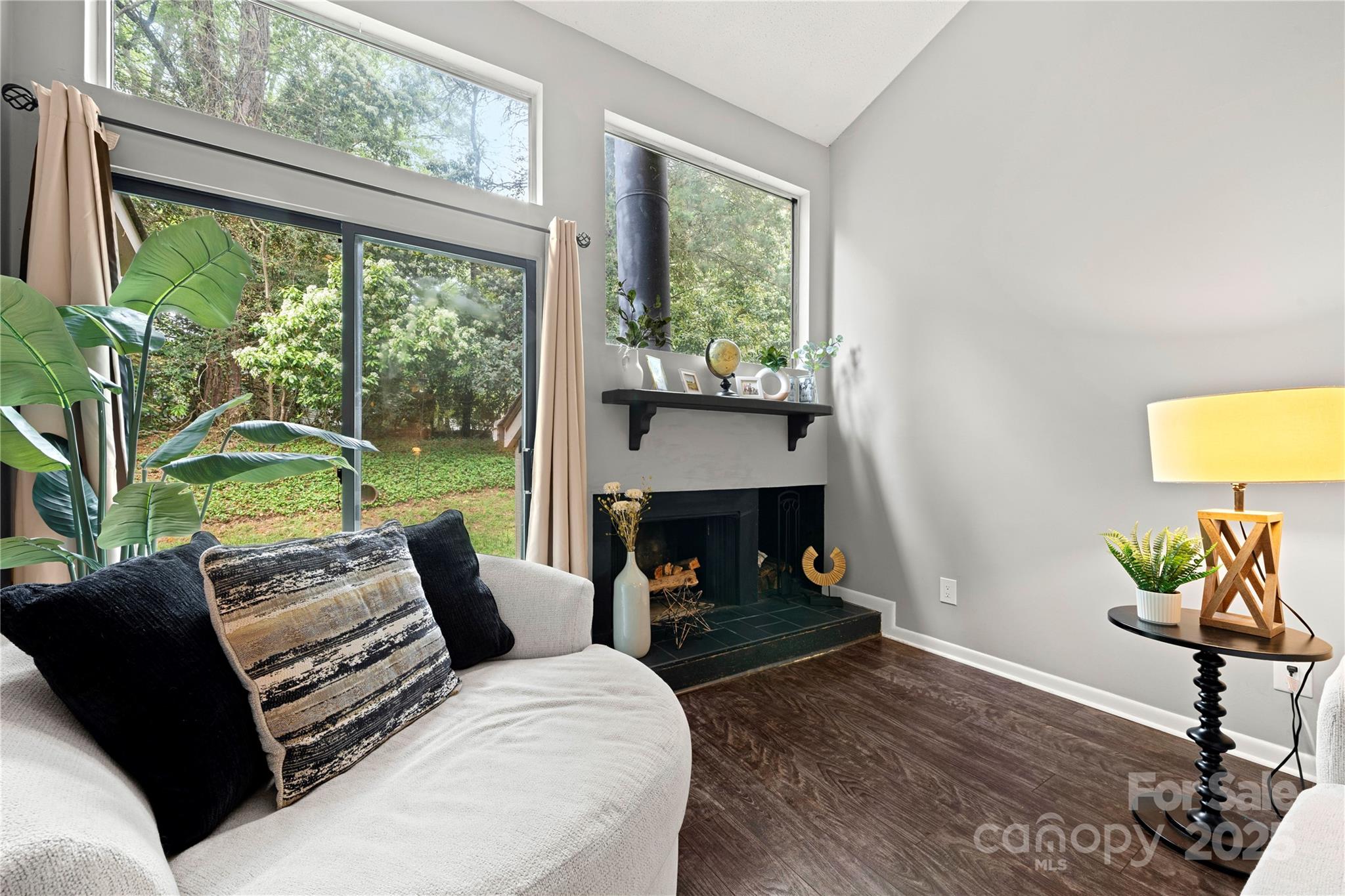 181 Riverview Terrace Clover, SC 29710 - Photo 17 of 43 a living room with furniture a fireplace and a large window