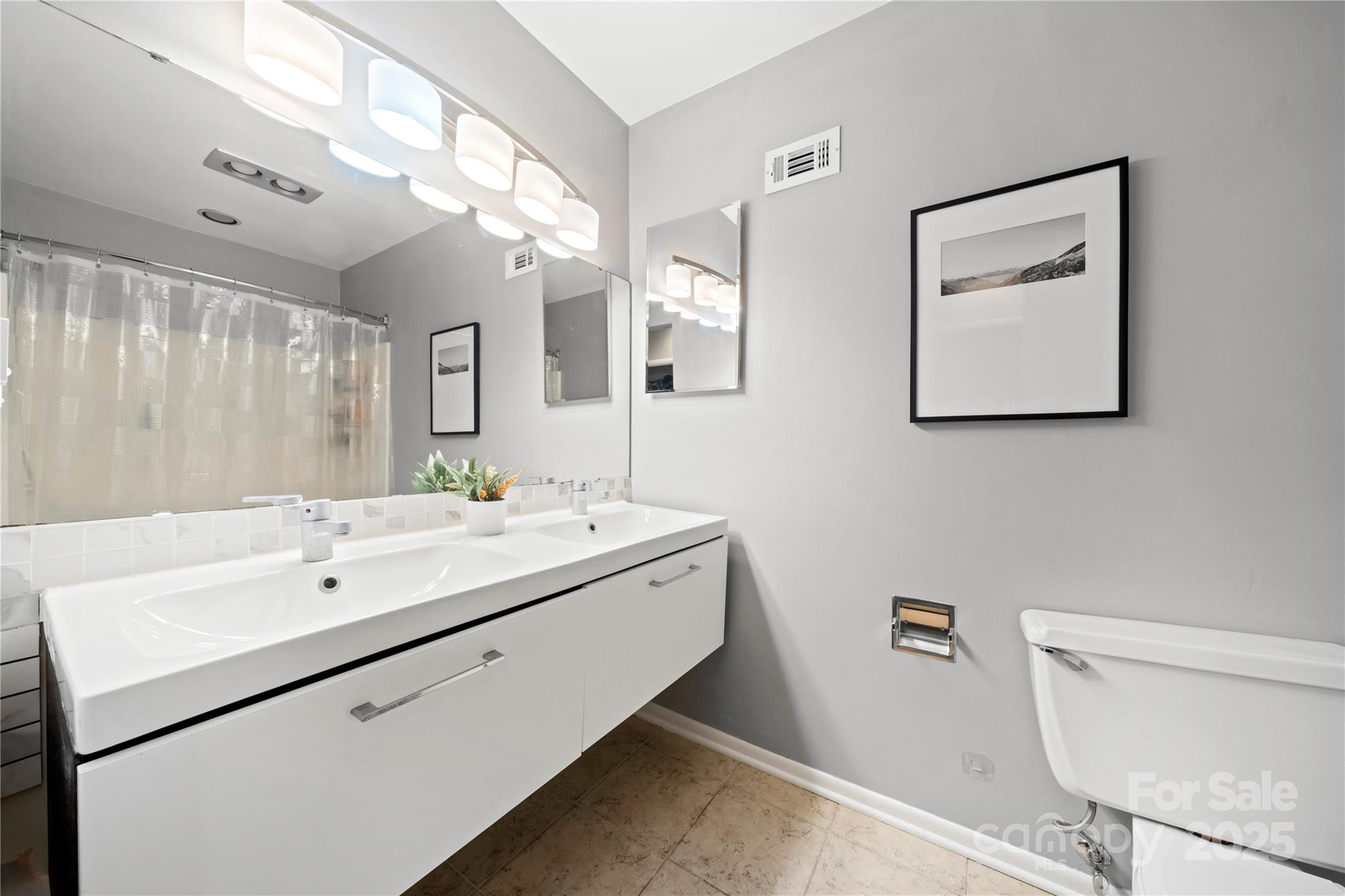 181 Riverview Terrace Clover, SC 29710 - Photo 28 of 43 a bathroom with a double vanity sink mirror and toilet