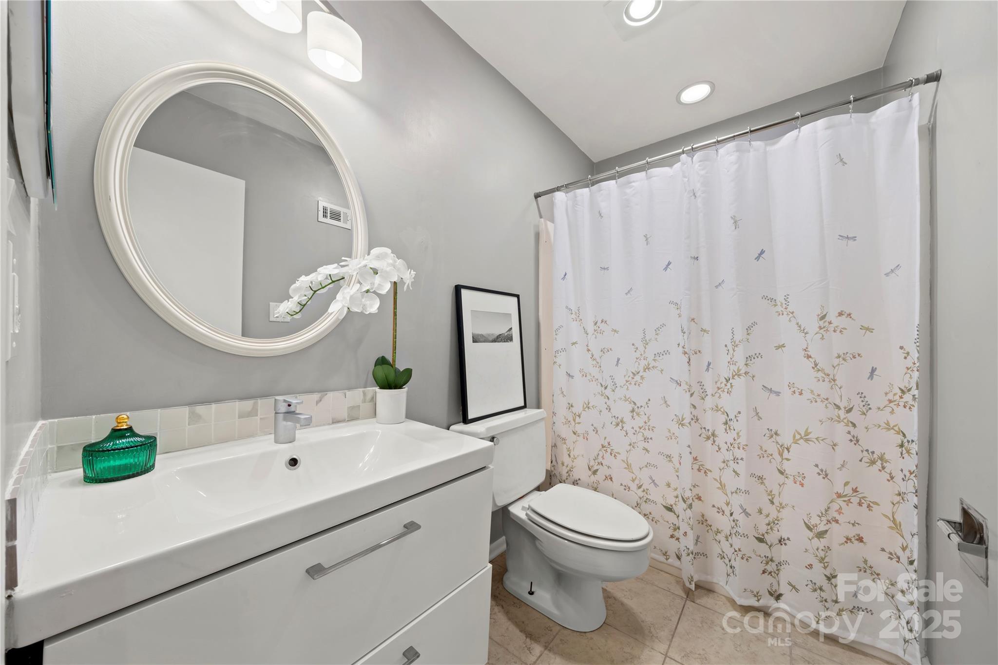 181 Riverview Terrace Clover, SC 29710 - Photo 31 of 43 a bathroom with a toilet sink and mirror