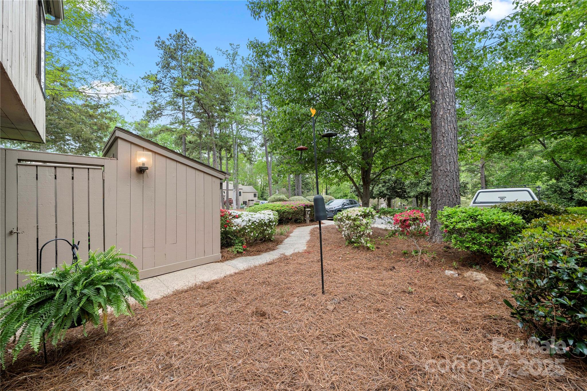 181 Riverview Terrace Clover, SC 29710 - Photo 34 of 43 a view of a backyard with potted plants and large tree