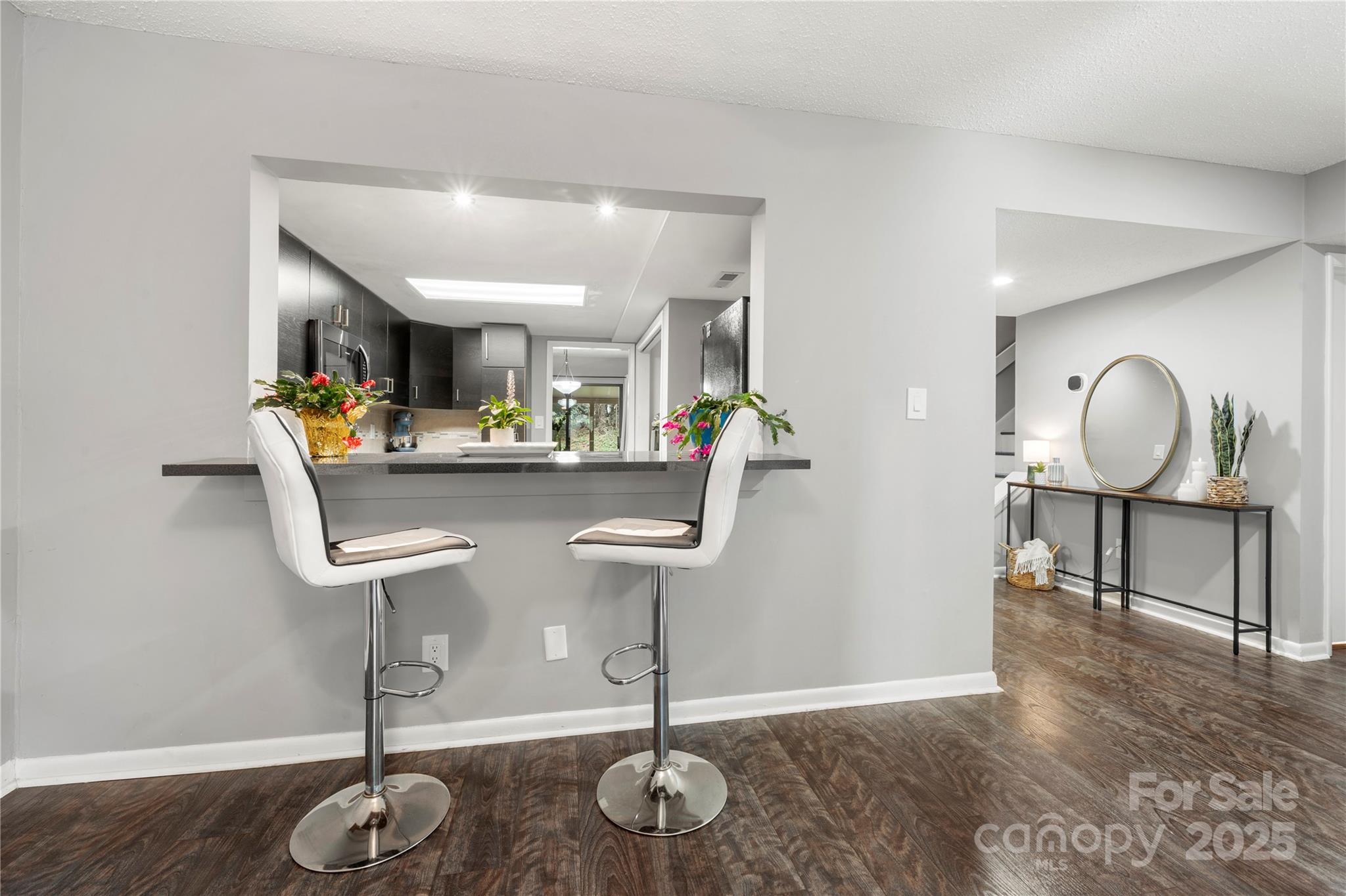 181 Riverview Terrace Clover, SC 29710 - Photo 8 of 43 a view of dining room and kitchen island with wooden floor