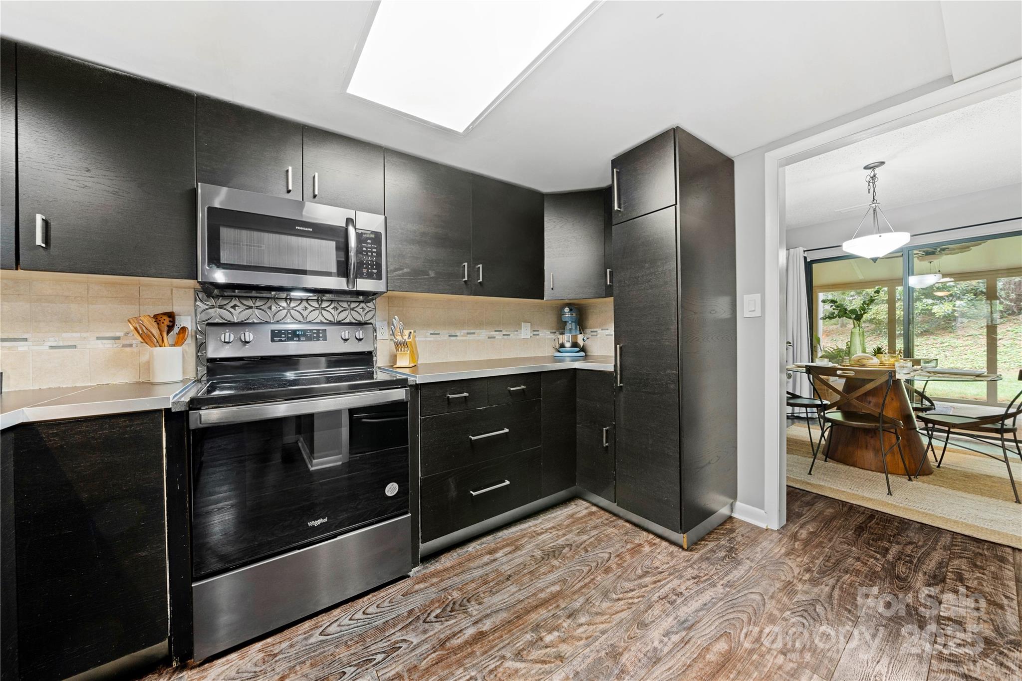 181 Riverview Terrace Clover, SC 29710 - Photo 10 of 43 a kitchen with stainless steel appliances kitchen island granite countertop a stove a sink and a refrigerator