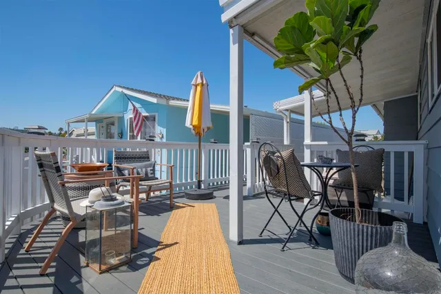 a view of a chairs and table in patio