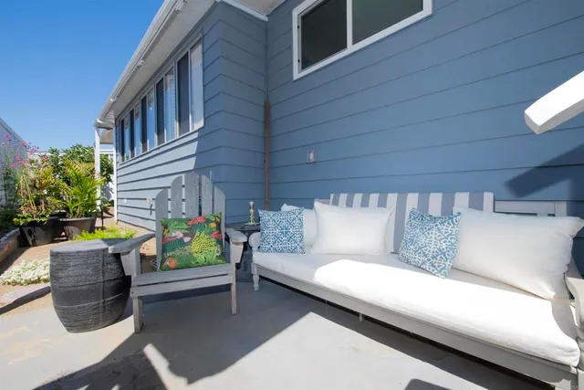 a outdoor living space with furniture and a potted plant