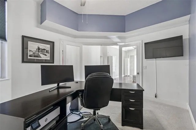 a view of a hallway with a hardwood and front door