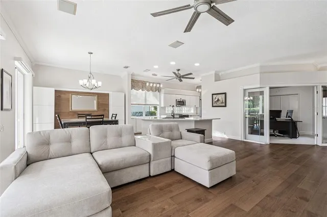 a large kitchen with stainless steel appliances granite countertop a refrigerator and a sink