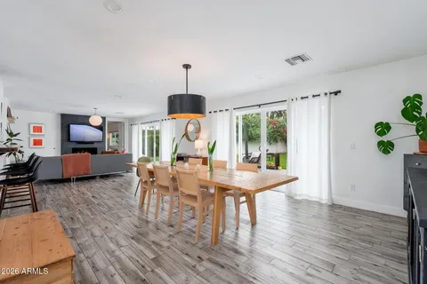 a view of a dining room with furniture window and wooden floor