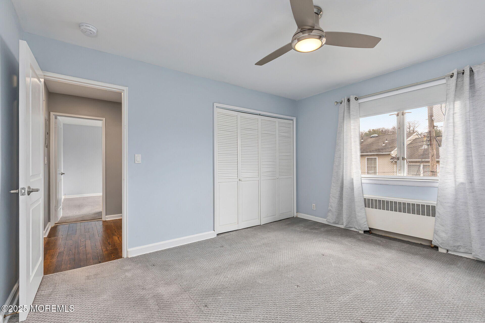 293 Spring Street, Unit 15D Red Bank, NJ 07701 - Photo 14 of 28 a view of empty room with ceiling fan