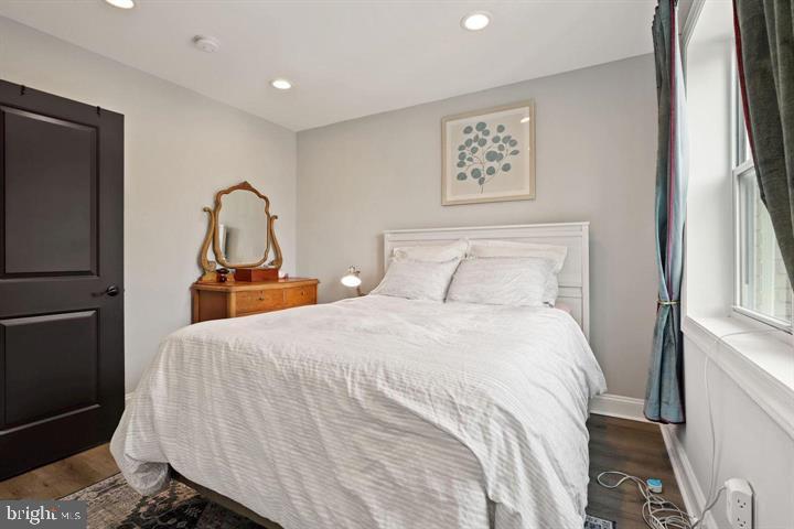 1634 Ridge Place Southeast Washington, DC 20020 - Photo 14 of 27 a bedroom with a bed and a painting on the wall