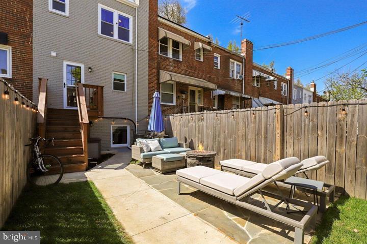 1634 Ridge Place Southeast Washington, DC 20020 - Photo 26 of 27 a view of a patio with a table and chairs with wooden fence
