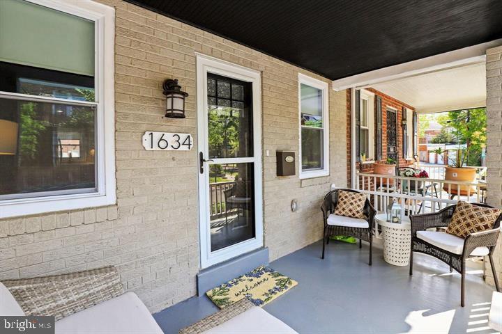 1634 Ridge Place Southeast Washington, DC 20020 - Photo 3 of 27 a outdoor living space with furniture and a potted plant