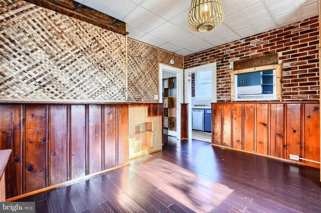 a kitchen with stainless steel appliances granite countertop a sink and wooden cabinets