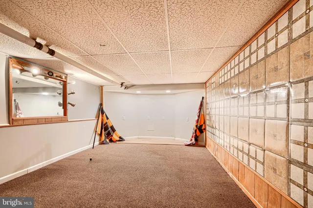 a view of a pathway with a house in the background