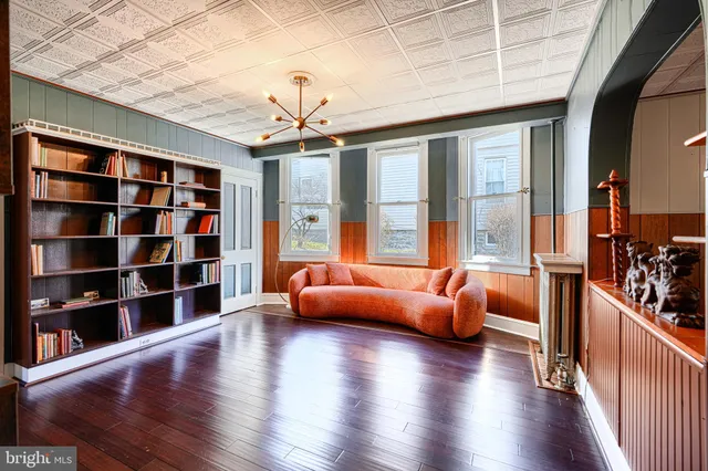 a view of a livingroom with furniture and staircase