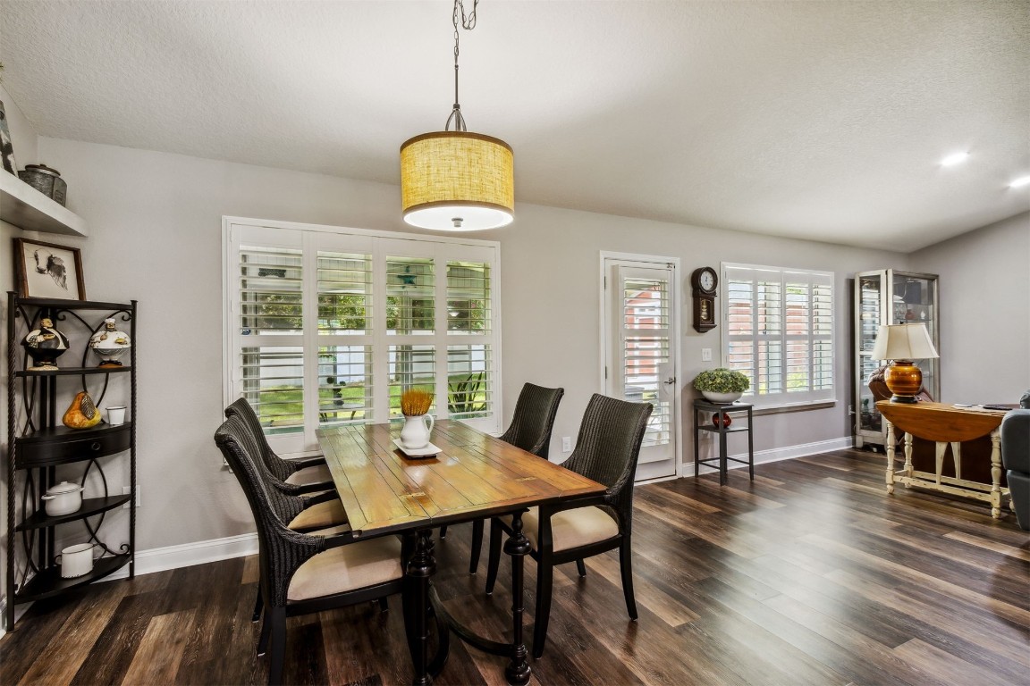 88033 Maybourne Road Yulee, FL 32097 - Photo 11 of 42 a view of a dining room with furniture window and wooden floor