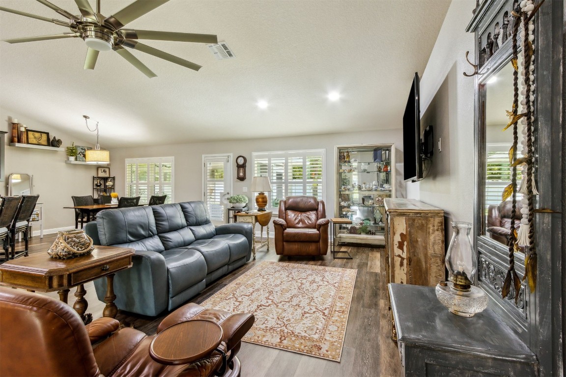 88033 Maybourne Road Yulee, FL 32097 - Photo 17 of 42 a living room with furniture and a flat screen tv