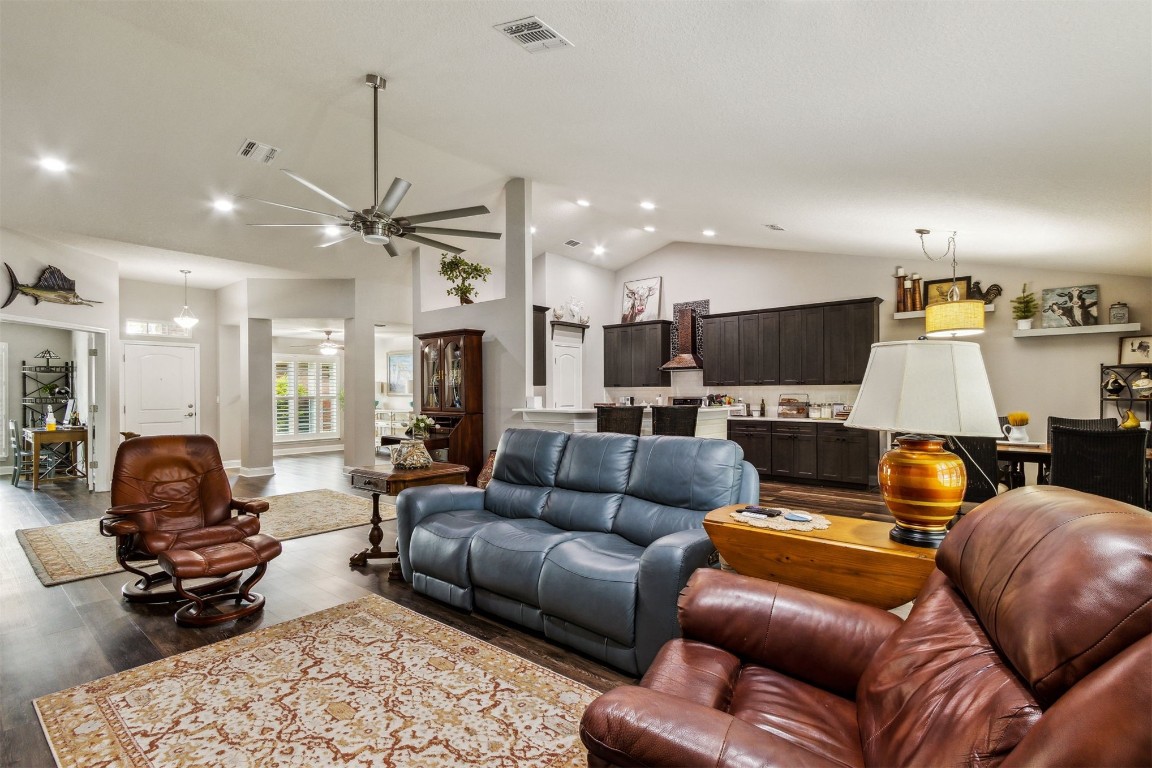 88033 Maybourne Road Yulee, FL 32097 - Photo 18 of 42 a living room with furniture kitchen view and a chandelier