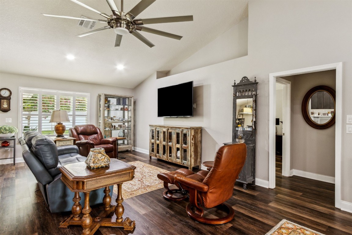 88033 Maybourne Road Yulee, FL 32097 - Photo 19 of 42 a living room with furniture a flat screen tv and a window