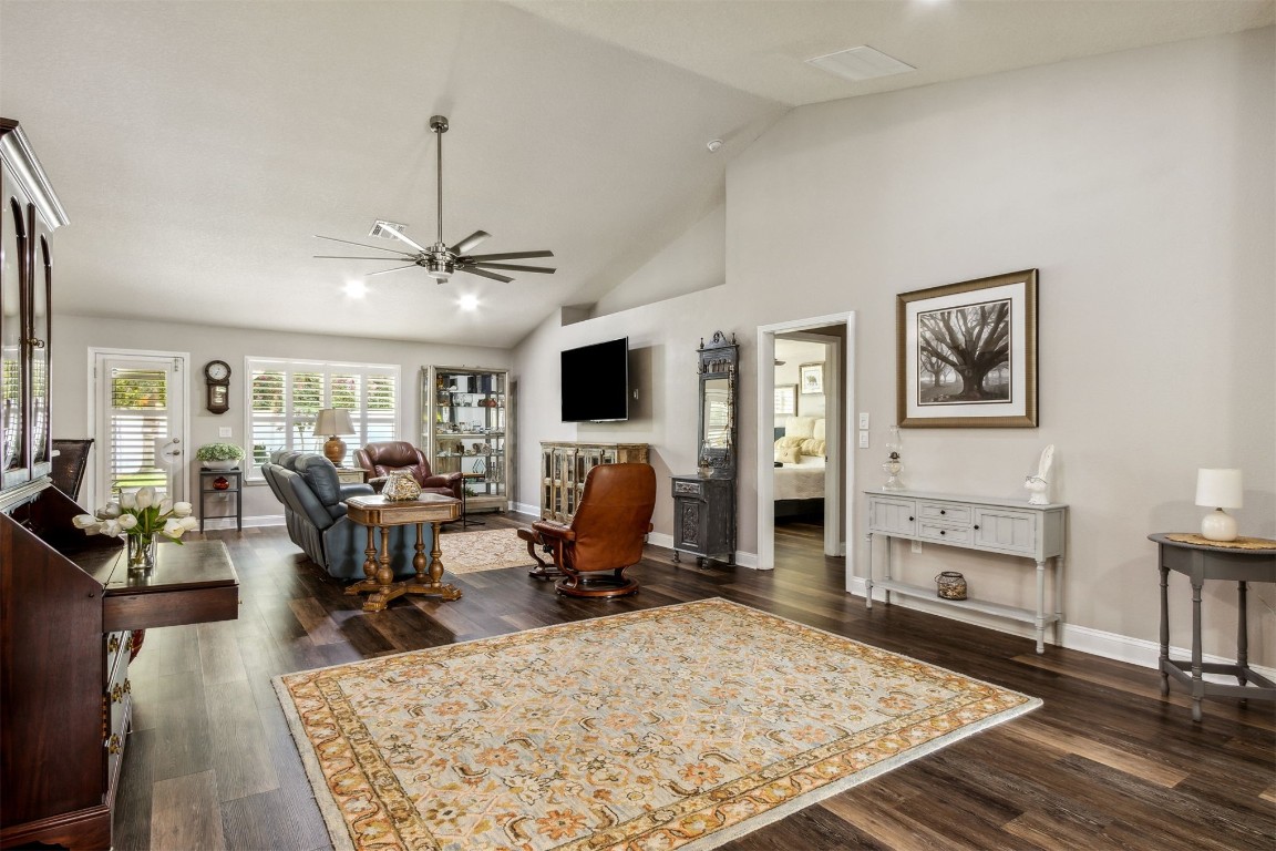 88033 Maybourne Road Yulee, FL 32097 - Photo 20 of 42 a view of a livingroom with furniture a rug wooden floor and a rug