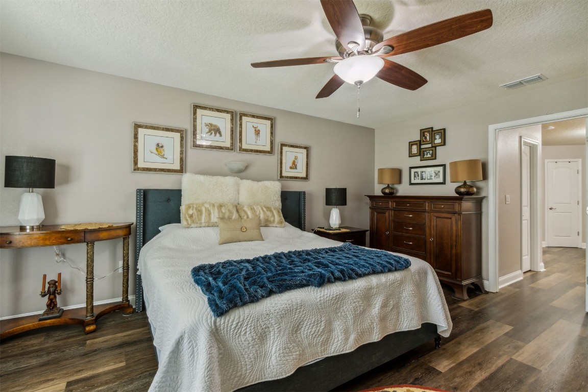 88033 Maybourne Road Yulee, FL 32097 - Photo 21 of 42 a bedroom with a bed and a flat screen tv