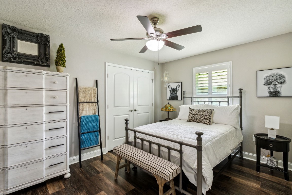 88033 Maybourne Road Yulee, FL 32097 - Photo 30 of 42 a bedroom with a bed a dresser and flat screen tv
