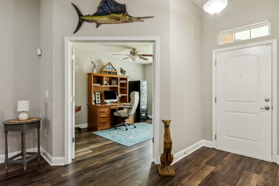 88033 Maybourne Road Yulee, FL 32097 - Photo 34 of 42 a view of an entryway with wooden floor and a livingroom view