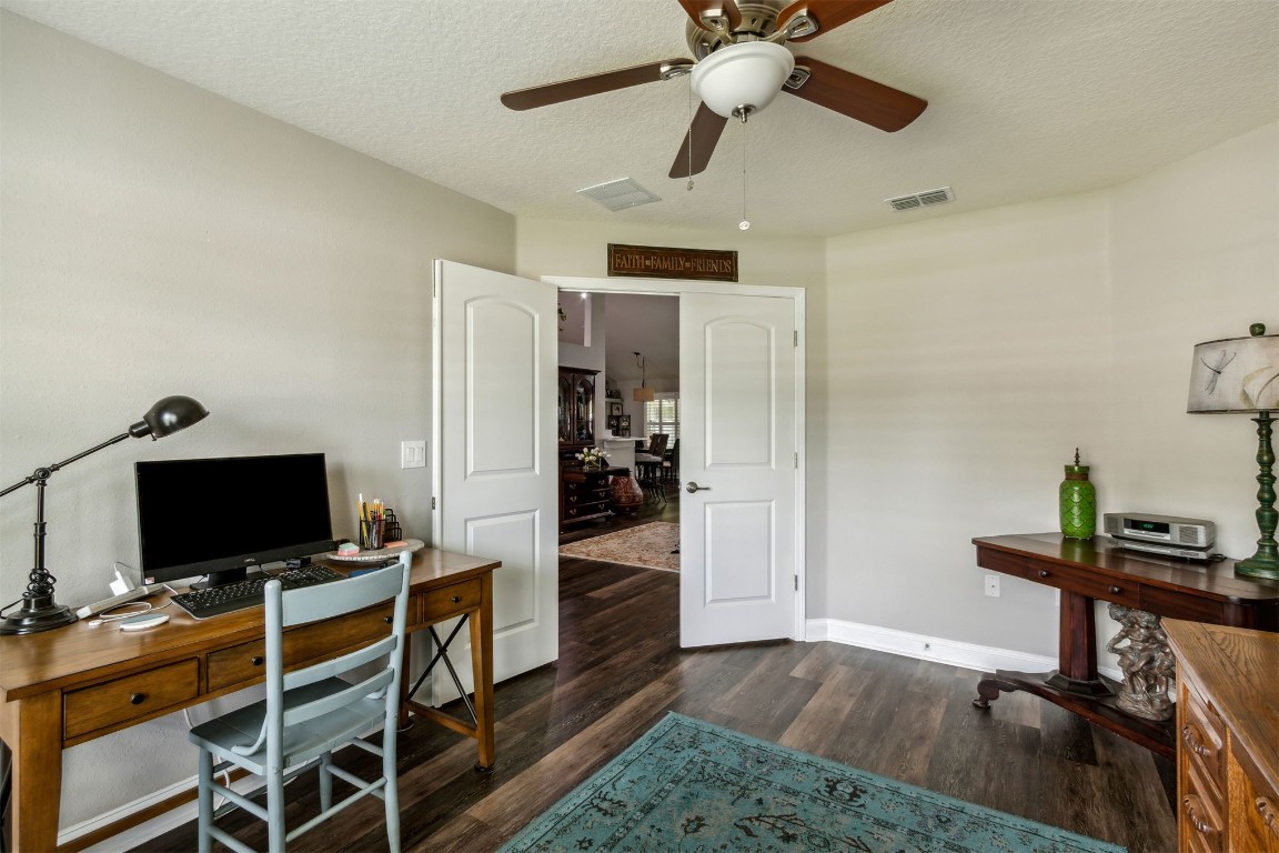 88033 Maybourne Road Yulee, FL 32097 - Photo 35 of 42 a view of a workspace with furniture and a flat screen tv