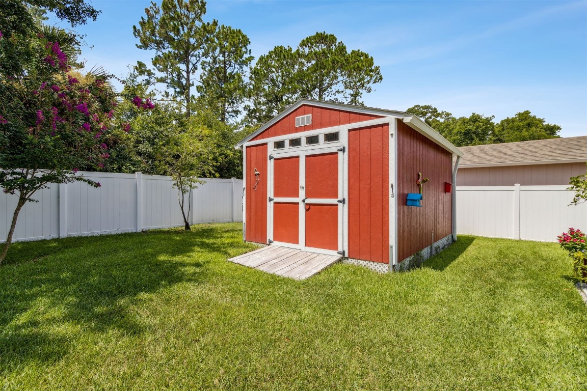 88033 Maybourne Road Yulee, FL 32097 - Photo 42 of 42 a front view of a house with a yard