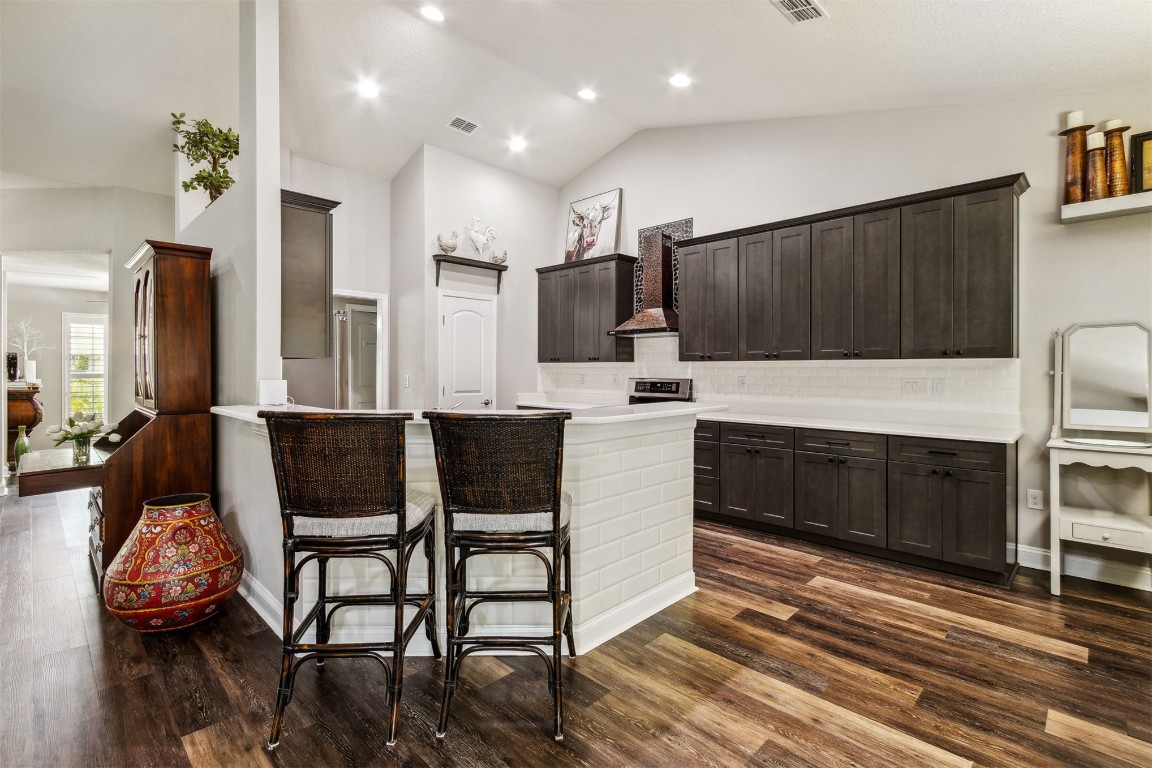 88033 Maybourne Road Yulee, FL 32097 - Photo 7 of 42 a large kitchen with a table and chairs