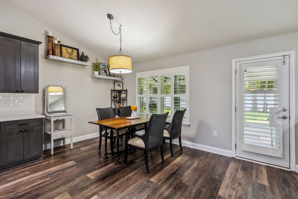 88033 Maybourne Road Yulee, FL 32097 - Photo 10 of 42 a view of a dining room with furniture window and wooden floor