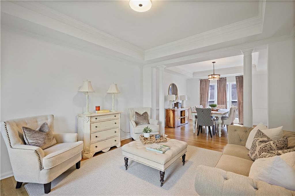 3038 Fairhaven Ridge Northwest Kennesaw, GA 30144 - Photo 13 of 55 a living room with furniture and a chandelier