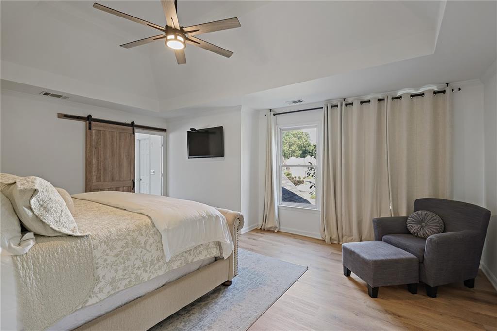 3038 Fairhaven Ridge Northwest Kennesaw, GA 30144 - Photo 16 of 55 a bedroom with a bed couch and a window