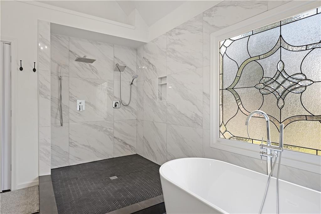 3038 Fairhaven Ridge Northwest Kennesaw, GA 30144 - Photo 20 of 55 a bathroom with a bathtub and shower