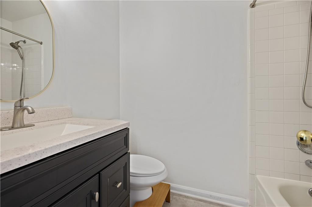 3038 Fairhaven Ridge Northwest Kennesaw, GA 30144 - Photo 23 of 55 a bathroom with a granite countertop sink toilet and a mirror